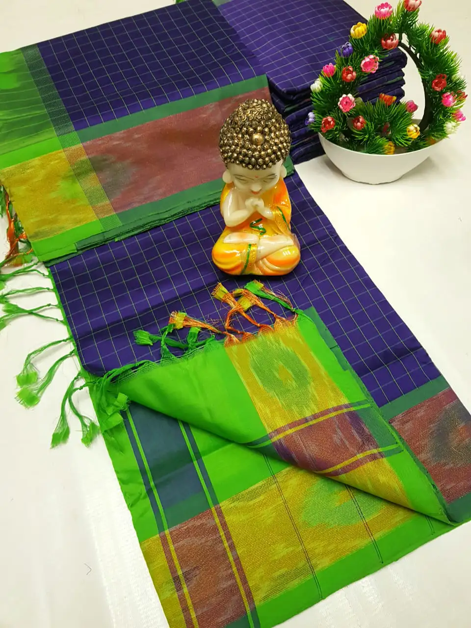 indigo tripura silk mahanati checks saree with parrot green pochampally border