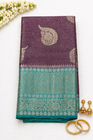Mauve Banaras Pattu saree with aqua blue zari woven border and traditional motif design
