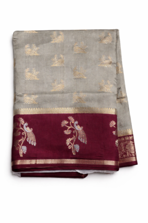 Elegant grey banarasi soft silk saree highlighted with gold motifs, a rich maroon zari border, and a beautifully detailed floral pallu.