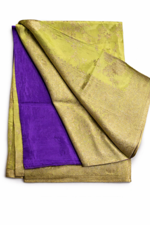 adiant lime green Banarasi silk saree with intricate gold zari floral weaving, rich traditional border, and a bold contrast purple blouse piece for festive elegance.
