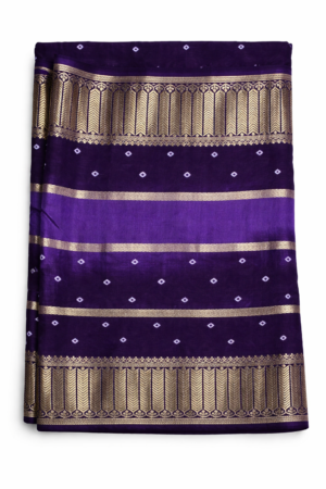 Elegant royal purple Bandhani saree featuring classic dotted motifs and rich gold zari woven borders for a timeless festive statement.