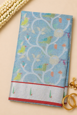 Sky blue Banaras Kota saree with bird motif weave, vine design, and silver zari border with red contrast edge