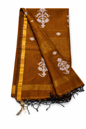 Brown cotton Jamdani saree featuring elegant white woven buti motifs, subtle zari-style highlights, and a graceful tassel finish for vibrant ethnic charm.