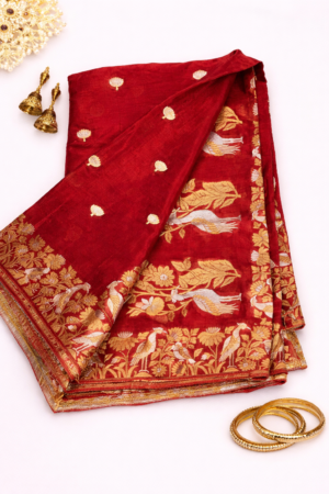 Stunning red Chinon silk saree adorned with elegant gold buti motifs and a richly woven traditional zari border for timeless festive charm.