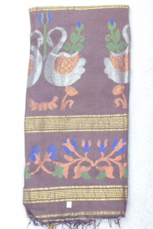 A graceful coffee brown linen Jamdani saree adorned with artistic peacock-inspired woven motifs, multicolor floral accents, and elegant tassels for a refined ethnic look.