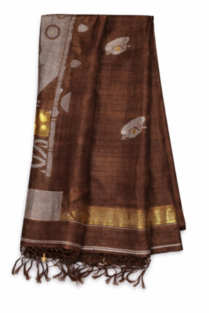 Elegant coffee brown Matka silk Jamdani saree featuring subtle artistic woven motifs, rich handcrafted texture, and a graceful tassel-finished pallu.