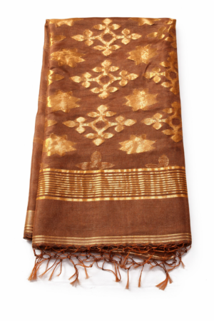 Graceful copper brown linen Jamdani saree featuring rich gold floral woven motifs, soft metallic sheen, and tassel-finished pallu for elegant festive charm.