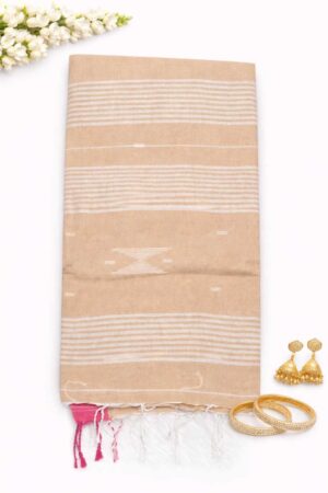 Elegant pastel orange cotton Jamdani saree featuring subtle white geometric woven motifs, soft striped detailing, and a graceful minimalist handloom-inspired look.