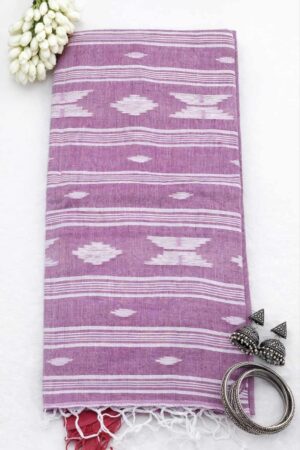 Pastel pink cotton Jamdani saree featuring crisp white geometric woven motifs, fine stripe detailing, and a timeless handloom-inspired ethnic appeal.