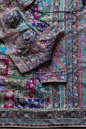 violet-purple crepe designer saree, where timeless grace meets modern glamour.