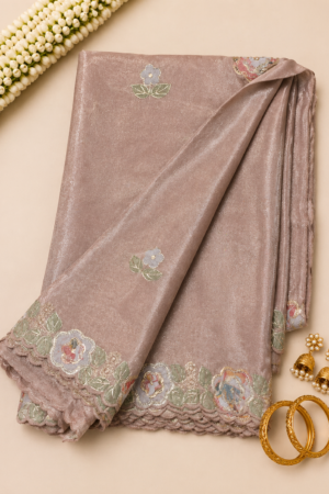 Dusty rose fancy tissue saree with floral embroidered scalloped border and delicate floral motifs