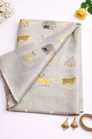 Graceful off white semi Gadwal saree featuring delicate woven motifs and a soft elegant finish for timeless festive charm.