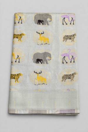 Graceful off white semi Gadwal saree featuring delicate woven motifs and a soft elegant finish for timeless festive charm.