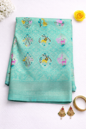 Refreshing aqua blue semi Gadwal saree adorned with delicate floral butis and a graceful traditional woven finish.