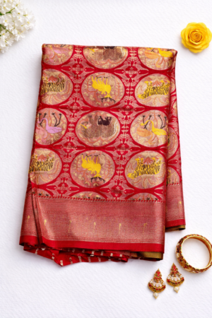Striking red semi Gadwal saree featuring artistic wildlife-inspired motifs, intricate medallion design, and an elegant zari woven border.