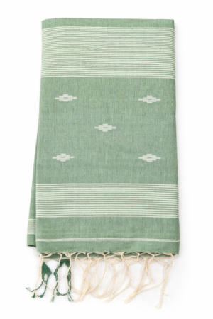 Soft and breathable mint green cotton Jamdani saree featuring delicate woven buti motifs and a graceful minimal handloom-inspired finish.
