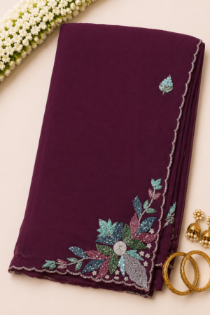 maroon maggam work saree with delicate handwork motif and scalloped stone embellished border