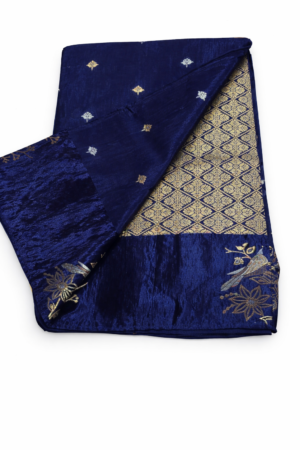 Rich navy blue Matka silk saree featuring delicate gold buti motifs, an elegant woven pallu, and artistic border detailing for a refined traditional look.