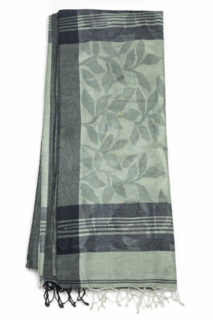 Elegant beige fancy Jamdani saree featuring allover grey leaf motifs, subtle woven texture, and tassel-finished pallu for understated sophistication.
