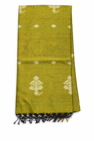 Green cotton Jamdani saree featuring elegant white woven buti motifs, subtle zari-style highlights, and a graceful tassel finish for vibrant ethnic charm.