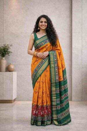 Orange Pochampally Ikat silk saree with green contrast border and traditional woven pallu