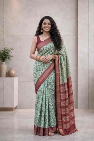 Ivory Pochampally Ikat saree with green woven work and rust contrast border