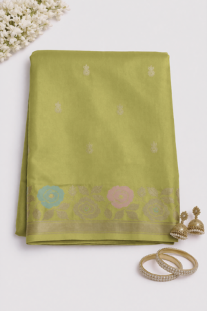 Radiant olive green Russian silk saree featuring elegant woven butis, a vibrant floral designer pallu, and a rich zari border for festive sophistication.