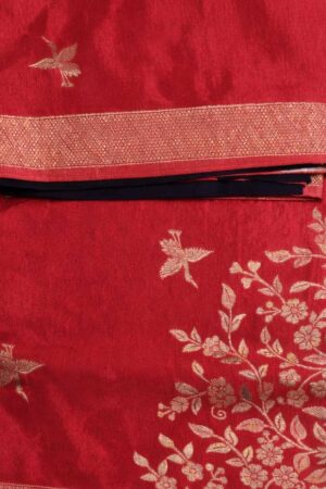 Elegant crimson red Russian silk saree featuring delicate bird motifs, a graceful floral woven panel, and a rich zari border for timeless festive charm.