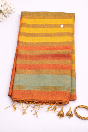 Elegant striped saree with warm hues, subtle sheen, and a beautifully finished tassel pallu.