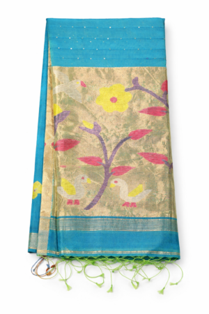 Graceful teal blue Jamdani fancy saree featuring delicate dotted detailing, a luminous tissue-style floral pallu, and elegant zari borders for festive charm.