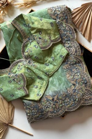 Mint green designer saree with heavy embroidered scalloped border and blouse