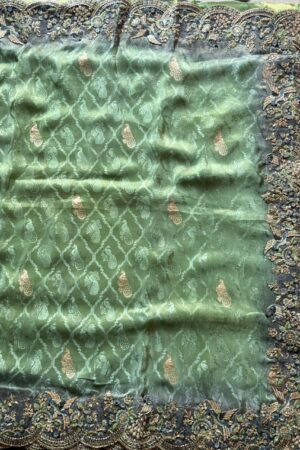 Mint green designer saree with heavy embroidered scalloped border and blouse