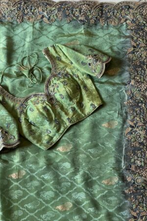 Mint green designer saree with heavy embroidered scalloped border and blouse