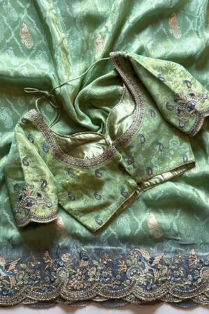 Mint green designer saree with heavy embroidered scalloped border and blouse