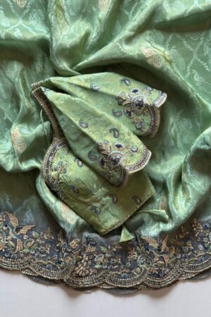 Mint green designer saree with heavy embroidered scalloped border and blouse