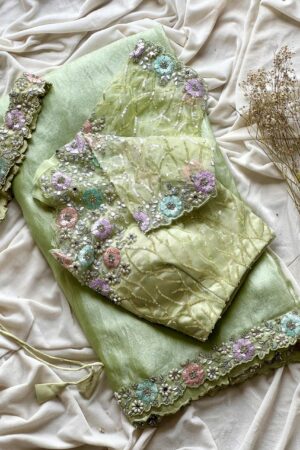 Pista green organza saree with 3D floral embroidery and designer blouse