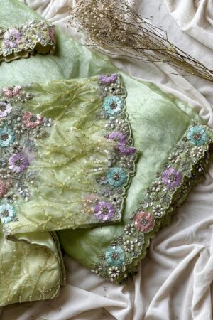 Pista green organza saree with 3D floral embroidery and designer blouse